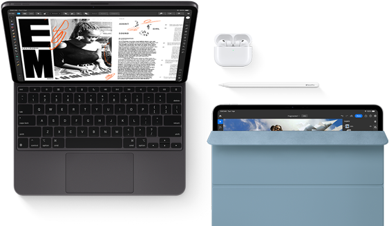 iPad Pro attached to Magic Keyboard, front exterior, space black color, rounded corners, black display bezel, open, display showing article editing app with text and photograph of a woman playing music, Airpods 4 in open case, blue Smart Folio cover on iPad Pro with Apple Pencil Pro resting atop device, cover slightly open revealing display